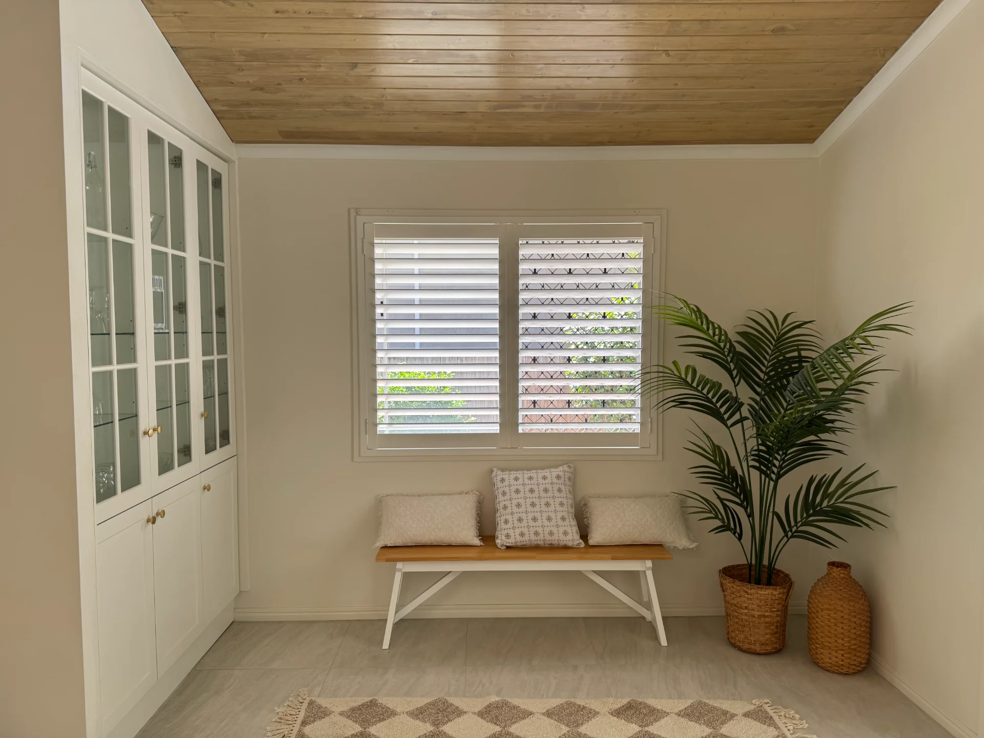 Hinged plantation shutters in a Helensvale living room