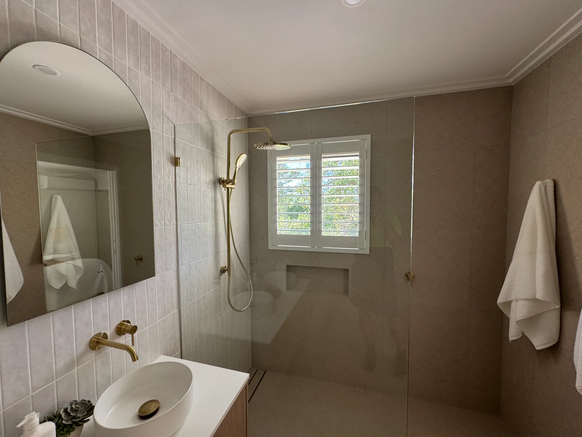 Moisture-resistant plantation shutters in a Southport bathroom